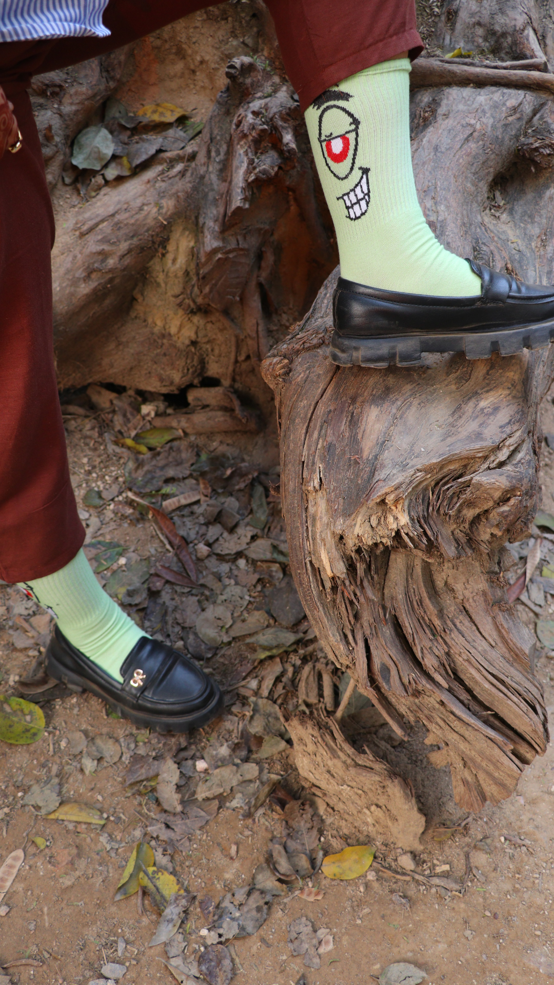 Model wearing Devil Red Eye funky unisex cotton socks – crew-length, stylish and vibrant statement socks for everyday wear.